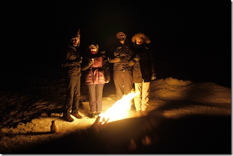 Roadside bonfire when hunting Aurora / Northern Lights in Tromsø Norway