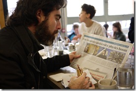 Dave reading about physics in a London cafe
