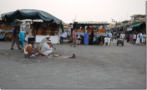 Cobra charmers in Djemaa el-Fna , Marrakech Morocco