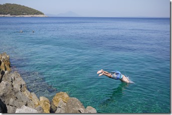 Jumping into the Adriatic Sea at Vali Lošinj on Lošinj Island, Croatia
